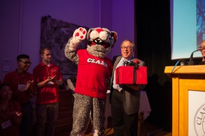 The Clark Cougar leads the audience in a rendition of "Happy Birthday" for Peter Klein '64.