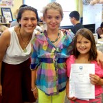 Hazelkorn ’15 is pictured with Brittany (age 13) a student at University Park Campus School, and Dakota, (age 8) who attends Goddard Elementary School